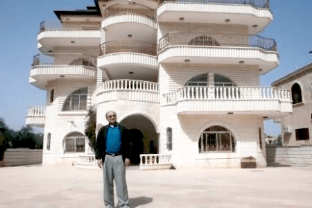 Ahmed Kassem in front of his villa of in the West Bank village of Turmus Aya