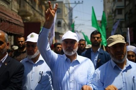 Hamas leader Ismail Haniyeh, center, and spokesman Fawzi Barhoum attend a protest in Gaza City on July 22, 2017, against new Israeli security measures implemented at the holy site, which include metal detectors and cameras, following an attack that killed two Israeli policemen the previous week. (AFP/Mohammed Abed)